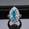 Pavé Burst Halo Marquise Cut Sapphire Birthstone Ring