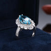Pavé Burst Halo Marquise Cut Sapphire Birthstone Ring